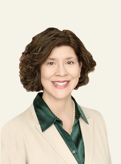 Photo of Dr. Linda A. LeBlanc, a light-skinned woman with dark hair, and a tan suit